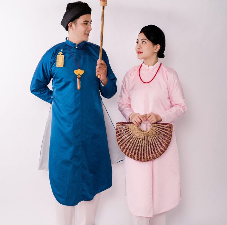 Traditional Vietnamese costumes - The bride and groom in their sleeveless Ao Dai